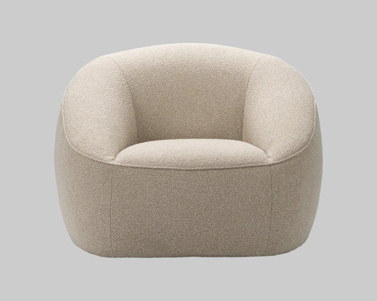 Beige armchair on a grey background