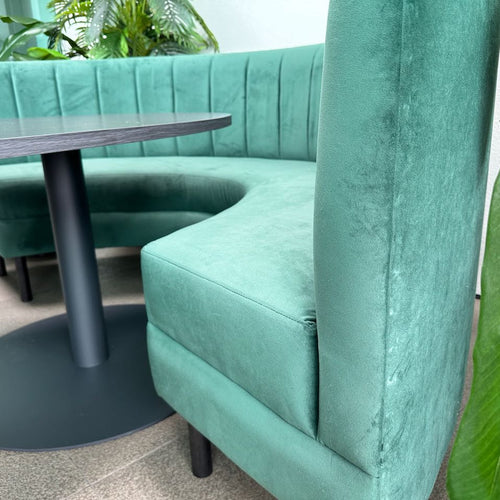 curved green banquette seat