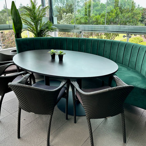 curved green banquette seat