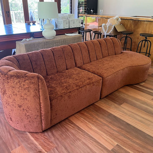 curved orange lounge