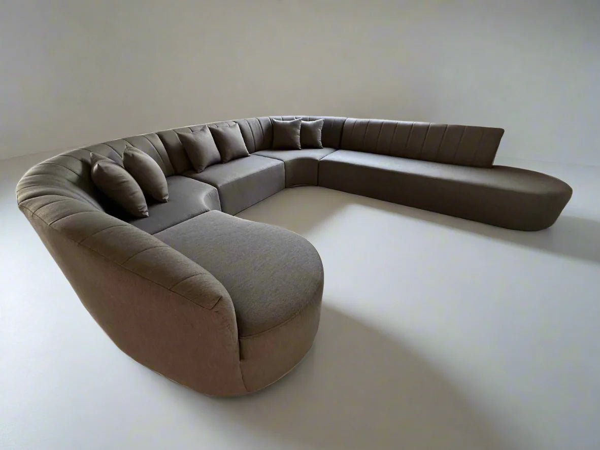 Cenna Curved Modular Lounge upholstered in textured bouclé in an open-plan Australian living room.