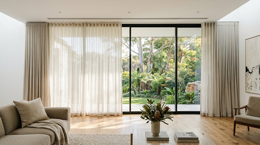 Custom S-Wave sheer linen curtains and layered blockout drapery on a recessed ceiling track in a Sydney living room by Leisure Lounges