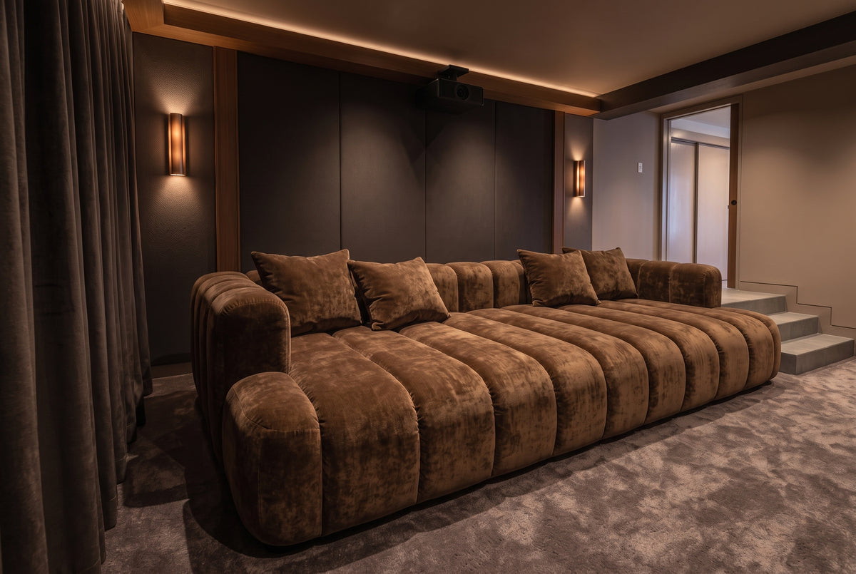 Three-quarter angle view of the Orpheus Theatre Daybed in rich chocolate velvet with bolster and scatter cushions.
