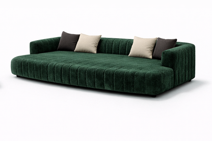 Orpheus theatre daybed in green velvet with channelled upholstery and cocooned arms