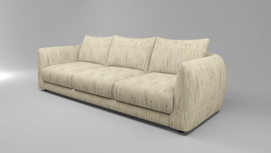 Three-quarter view of the cream Serene sofa, showing its rounded arms and full seating shape.